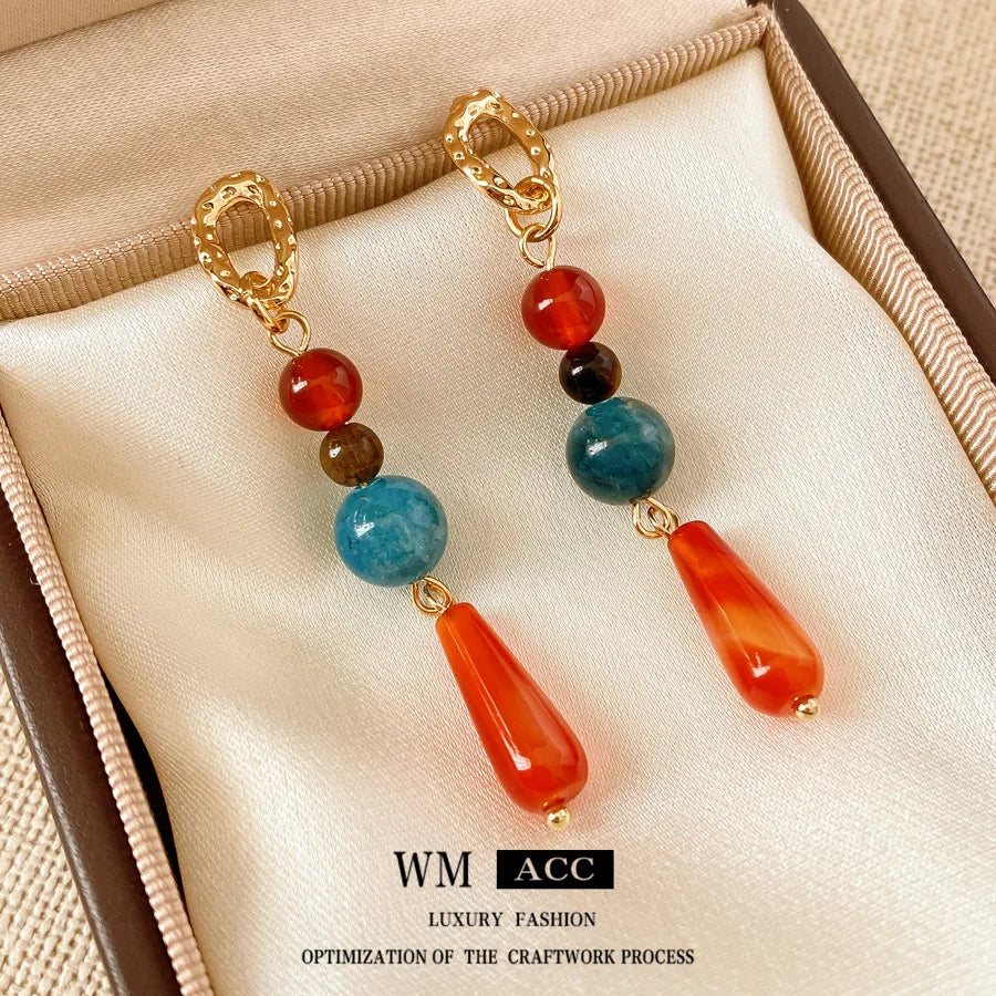 Discover the Elegance of Silver Pin Round Gemstone Bead Water Drop Tassel Earrings