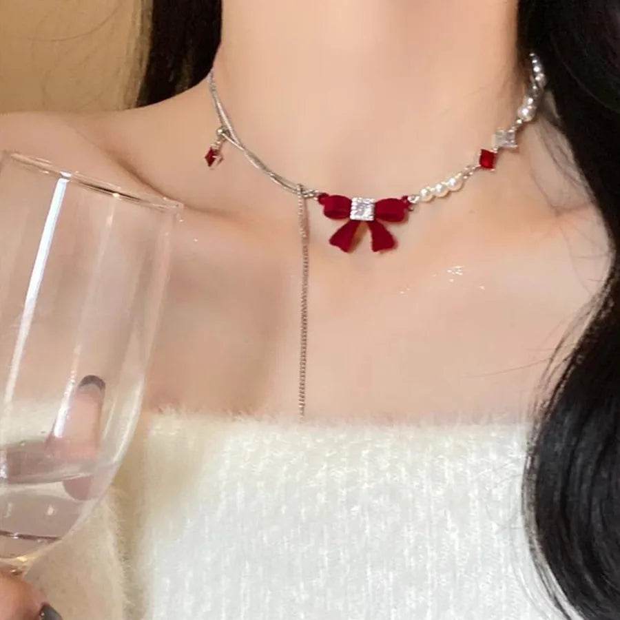 Discover the Elegance of the Velvet Bow Pearl Zircon Necklace