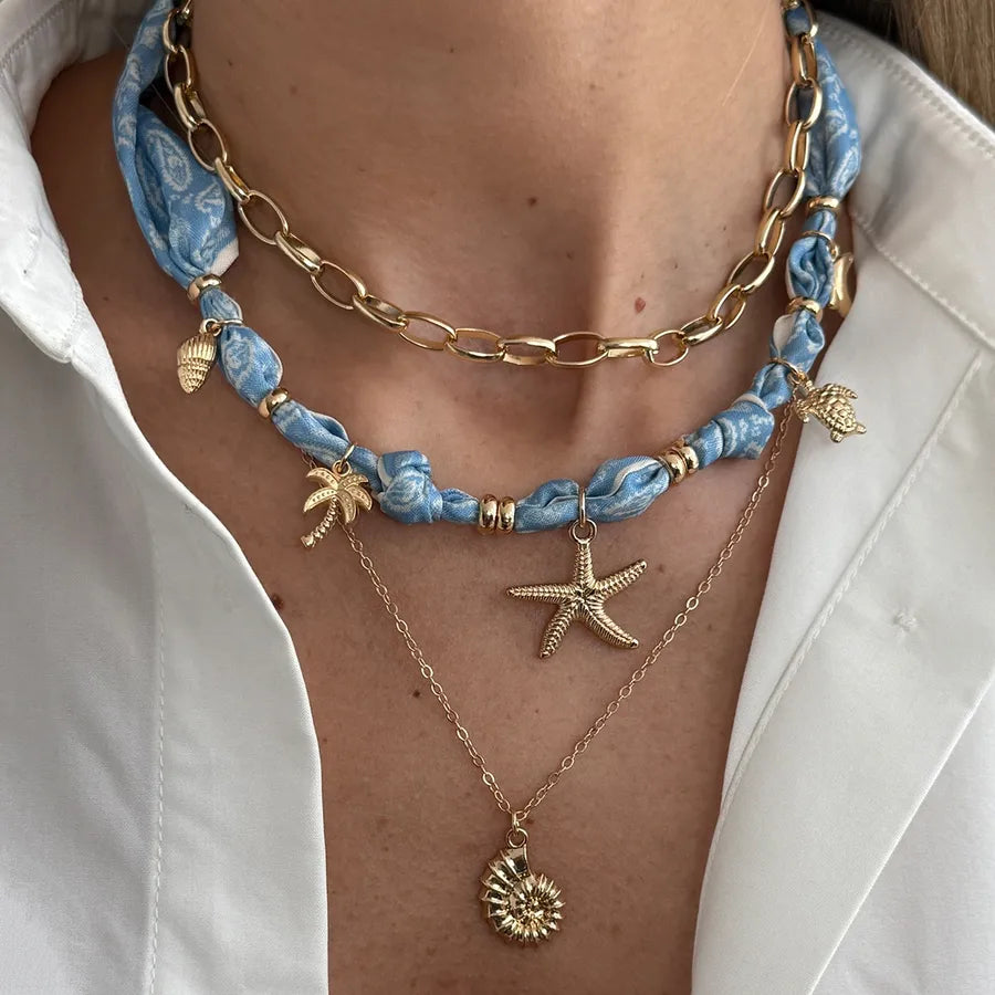 Discover the Ocean-Themed Star and Shell Pendant Necklace