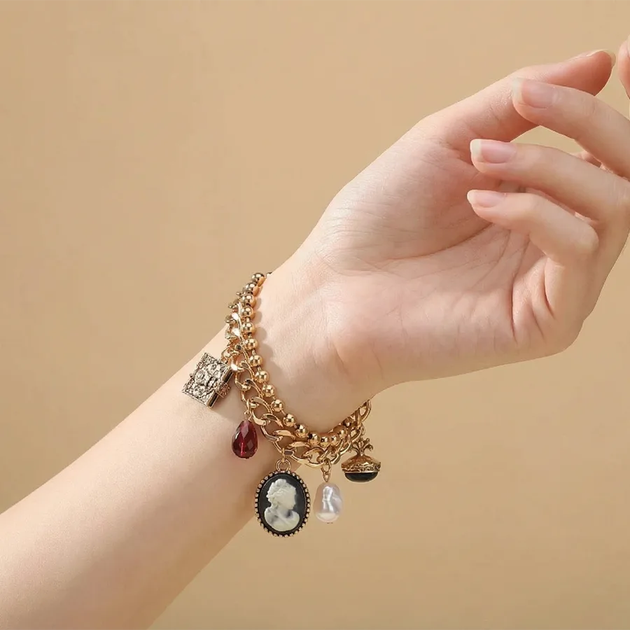 Discover Timeless Elegance with Our Vintage Imitation Gold Plated Metal Chain Multi-Pendant Bracelet