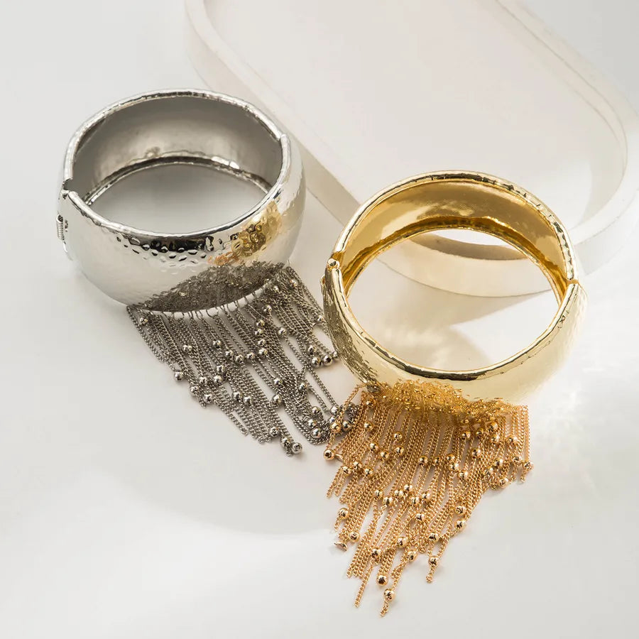 Elevate Your Style with the Vintage Grid Geometric Patchwork Metal Chain Tassel Bracelet