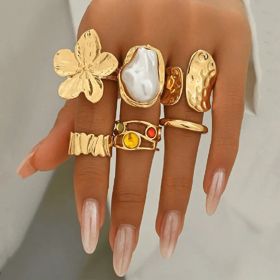 Discover the Elegance of the Imitation Baroque Pearl Liquid Lava Flower Ring Set