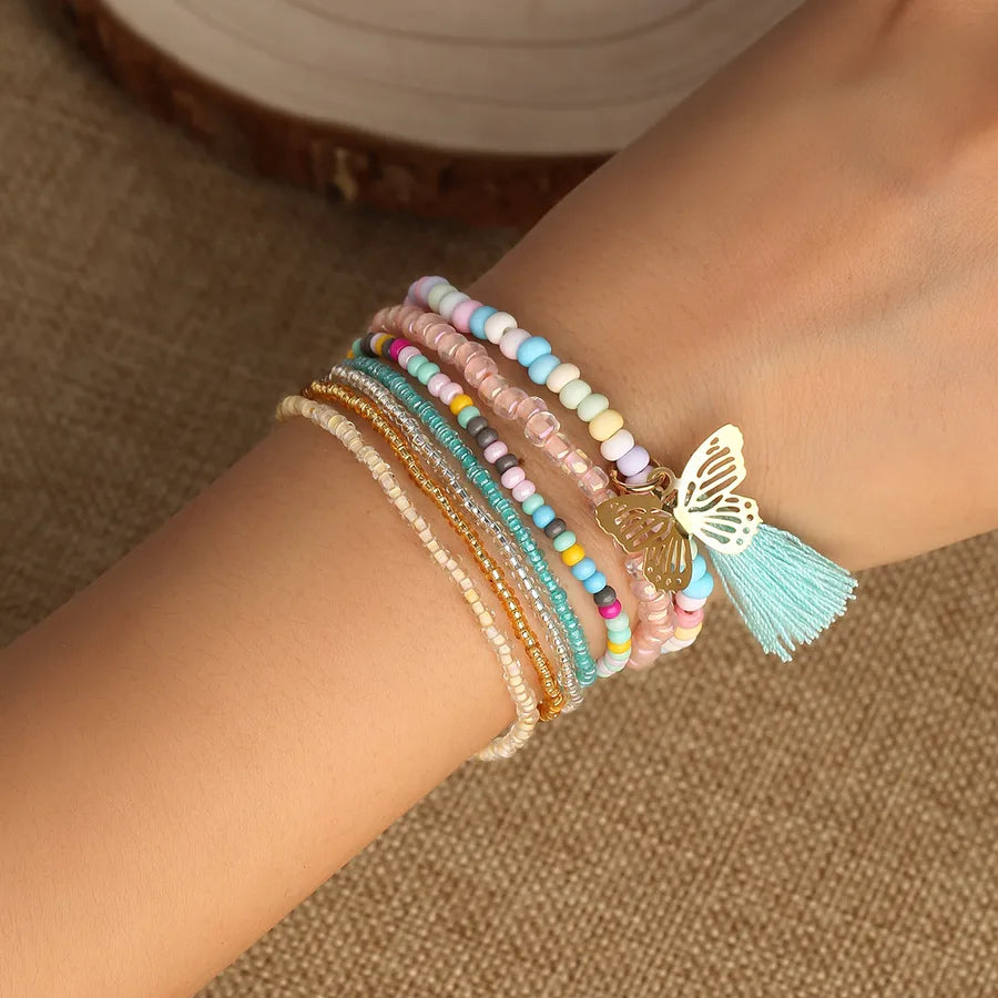 Discover the Elegance of the Butterfly Pendant Tassel Multi-Layer Bracelet