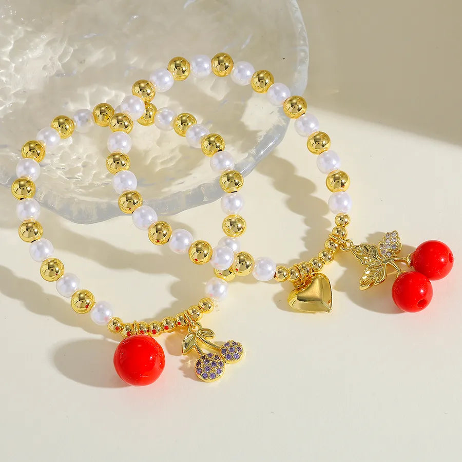 Elevate Your Style with the 18K Gold Plated Copper Zircon Cherry Heart Beaded Elastic Bracelet for Women
