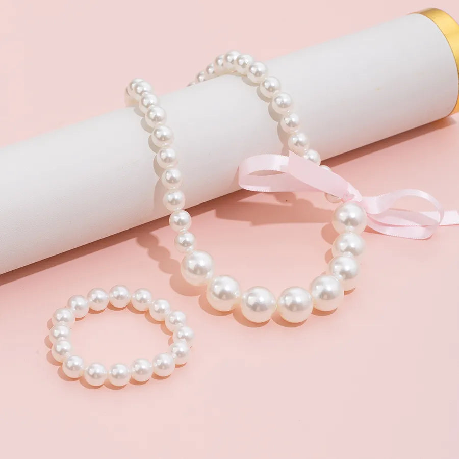 Elevate Your Style with the Pearl Bow Necklace