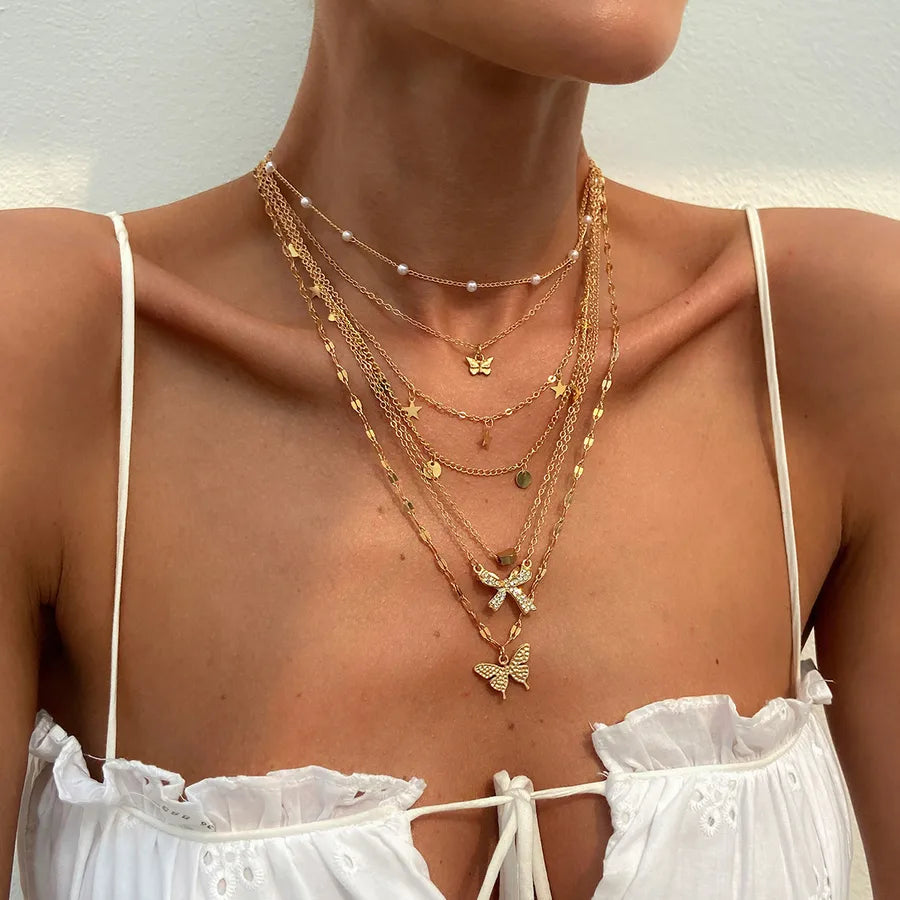 Elevate Your Style with the MY02 Gold Butterfly Pendant Necklace Set