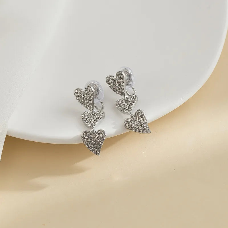 Elevate Your Style with Elegant Long Tassel Heart-Shaped Ear Cuffs