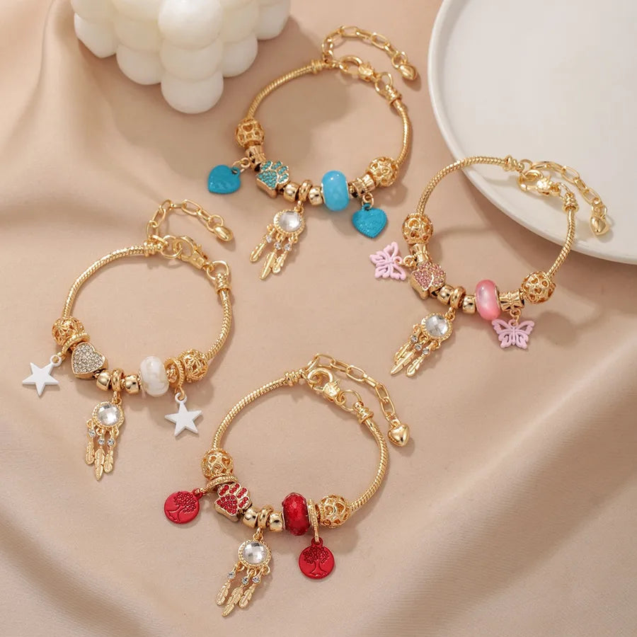 Discover the Elegance of the Gold Dreamcatcher Claw Heart-Shaped Bracelet