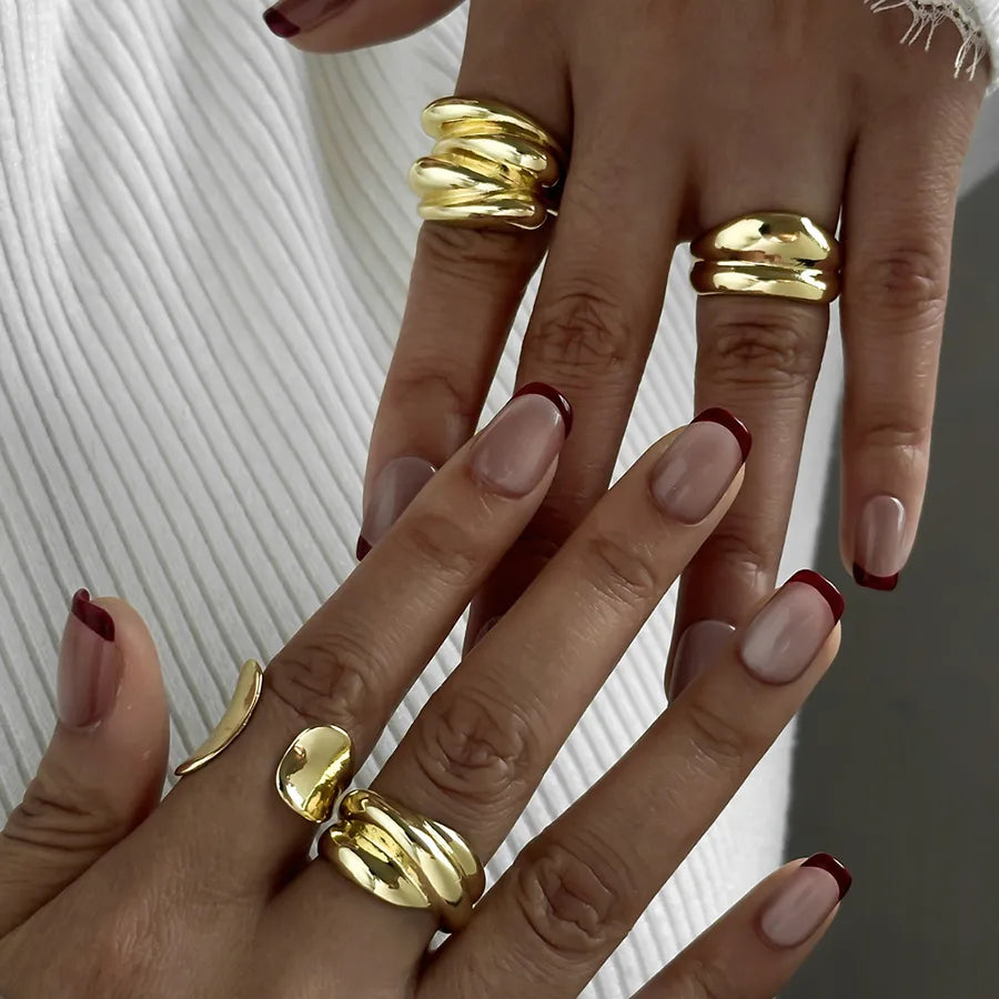 Elevate Your Style with the Multi-Layer Asymmetric Gold Ring Set