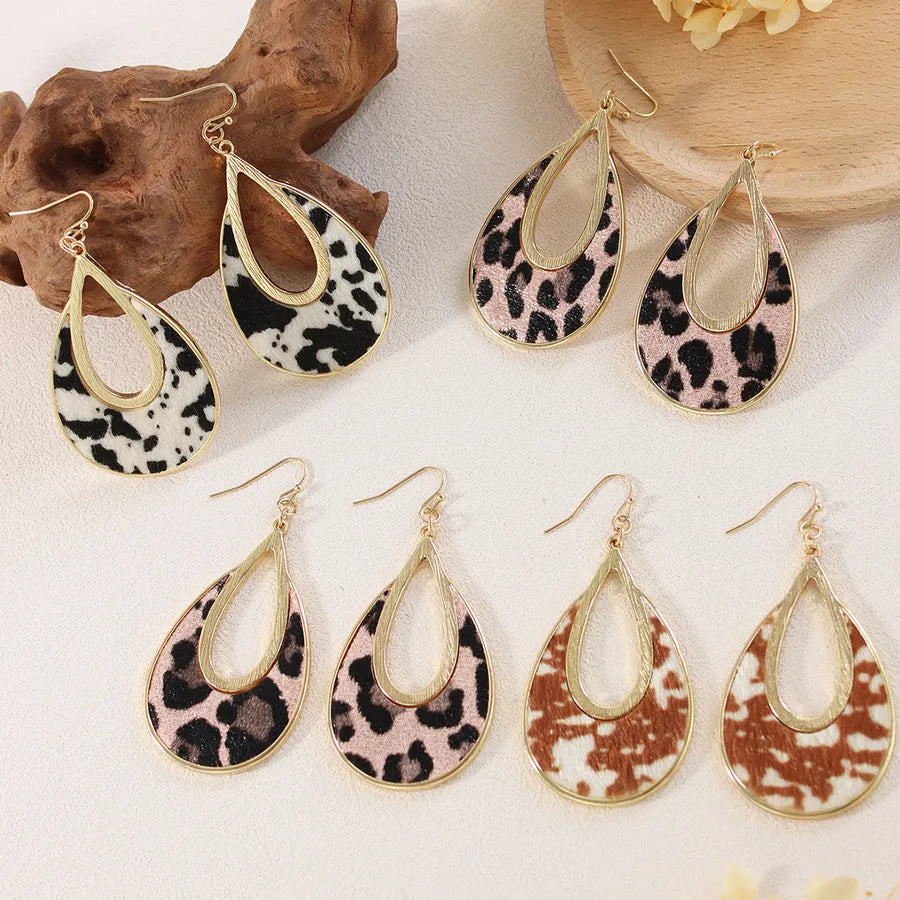 Elevate Your Style with Retro Horse Hair Leather Hollow Out Leopard Print Earrings