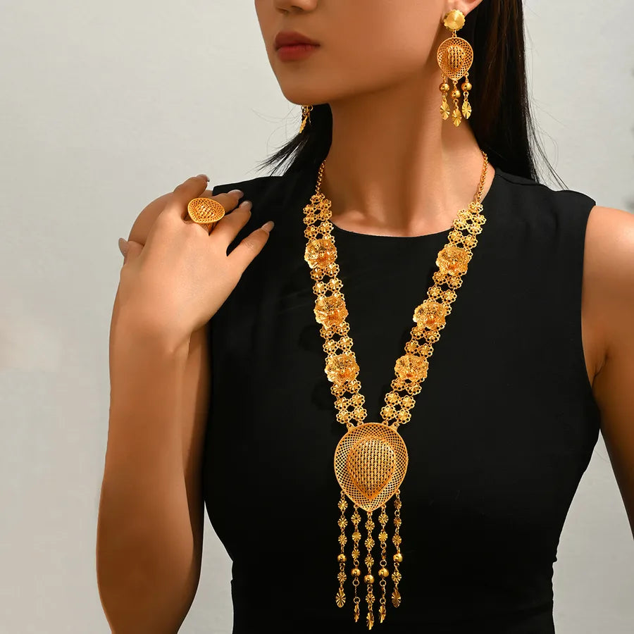 Elevate Your Elegance with the Vintage Hollow Water Drop Tassel Jewelry Set