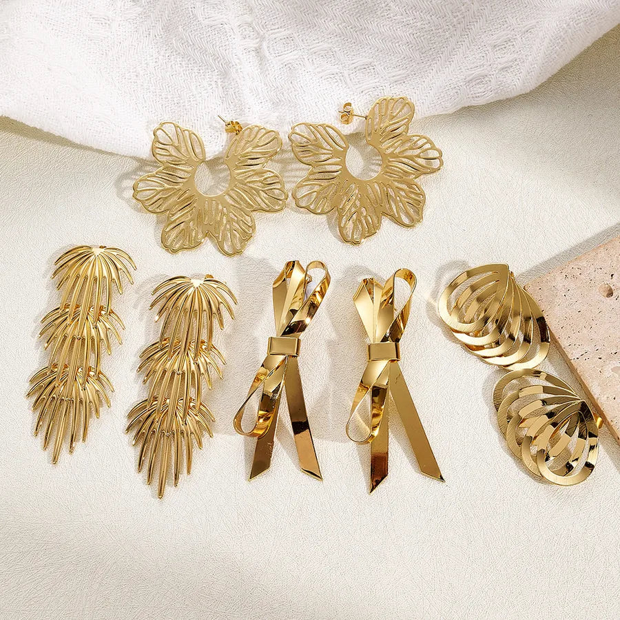 Discover the Elegance of Our Vacuum-Plated Gold Butterfly Leaf Flower Stud Earrings