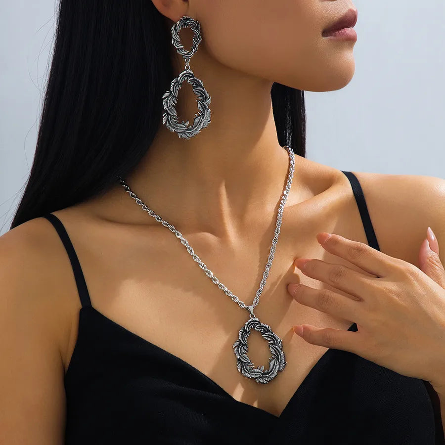 Elevate Your Style with the Women's Feather Shaped Water Drop Vintage Jewelry Set