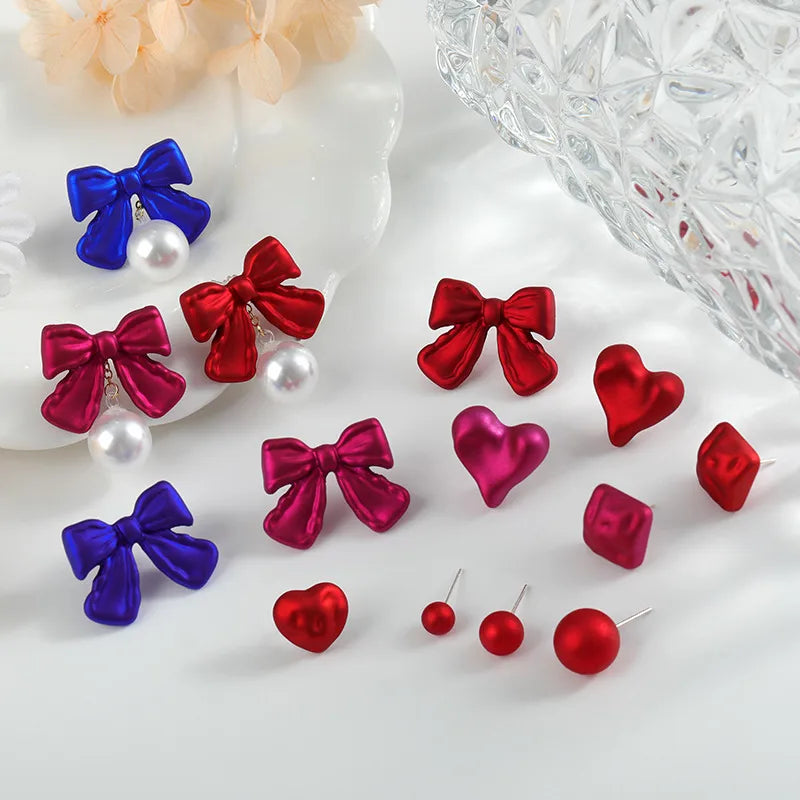 Discover the Allure of Fashionable Red Silver Needle Heart-Shaped Matte Earrings