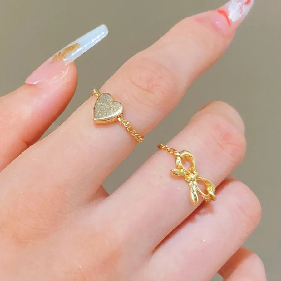 Discover the Elegance of the Heart Bowknot Chain Ring Set