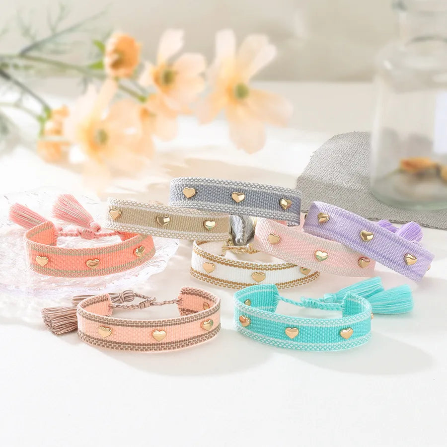 Discover the Elegance of Our Handmade Alloy Woven Heart Pendant Bracelet