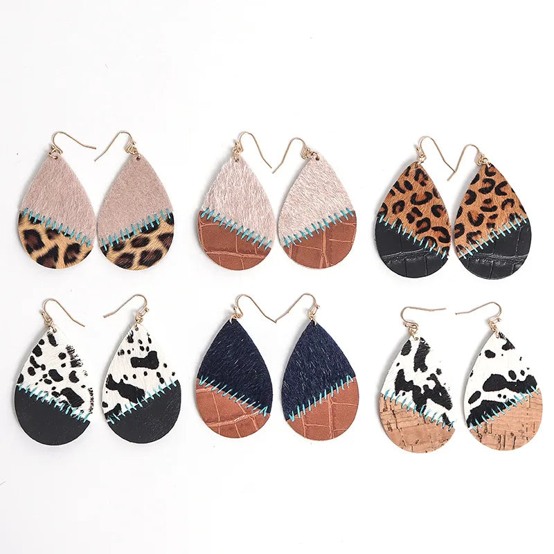 Elevate Your Style with Bohemian Hand-Sewn Cow Pattern Fashion Drop Earrings