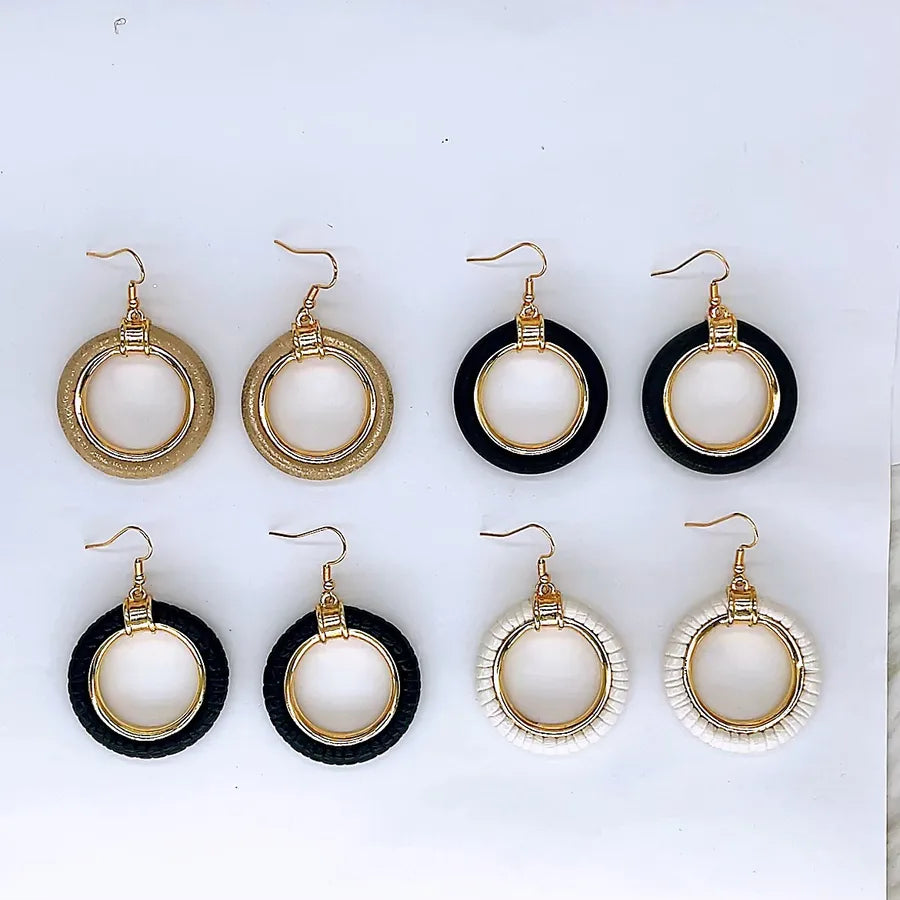 Exaggerated Round Leather Earrings: A Statement of Elegance