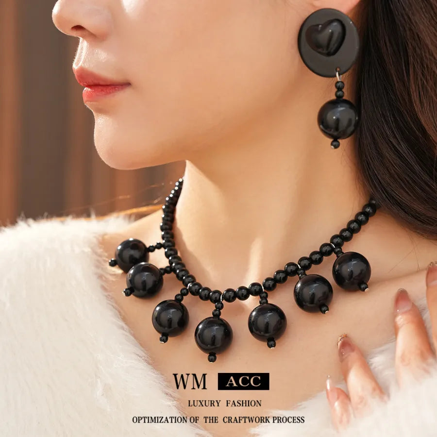 Elevate Your Style with the Black Acrylic Bead Tassel Earrings Necklace Set