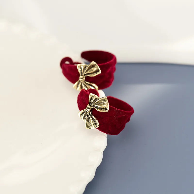 Discover the Elegance of Vintage Hong Kong Style Wine Red Butterfly Knot Earrings